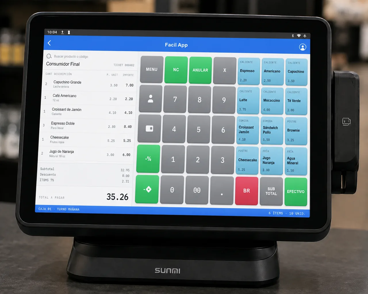 Terminal FácilPos sobre el mostrador con la caja registradora abierta — grilla de botones configurables con MENU, NC, ANULAR, teclado numérico y SUB TOTAL/EFECTIVO